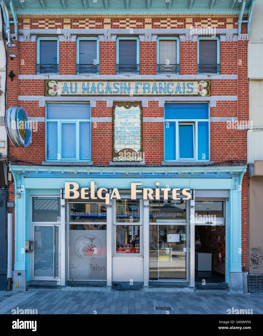 Facade of a traditional Belgian or French Fries fast food restaurant at the railway station of Mouscron, Hainaut, Belgium, 10 April 2025 Stock Photo