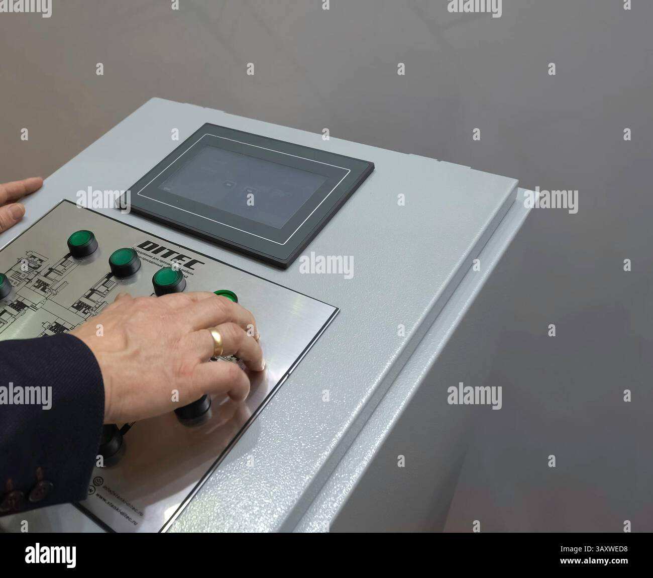 Control panel for asynchronous motors. Operator at work at the control panel. Stock Photo