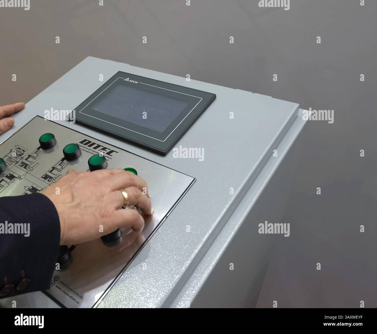 Control panel for asynchronous motors. Operator at work at the control panel. Stock Photo