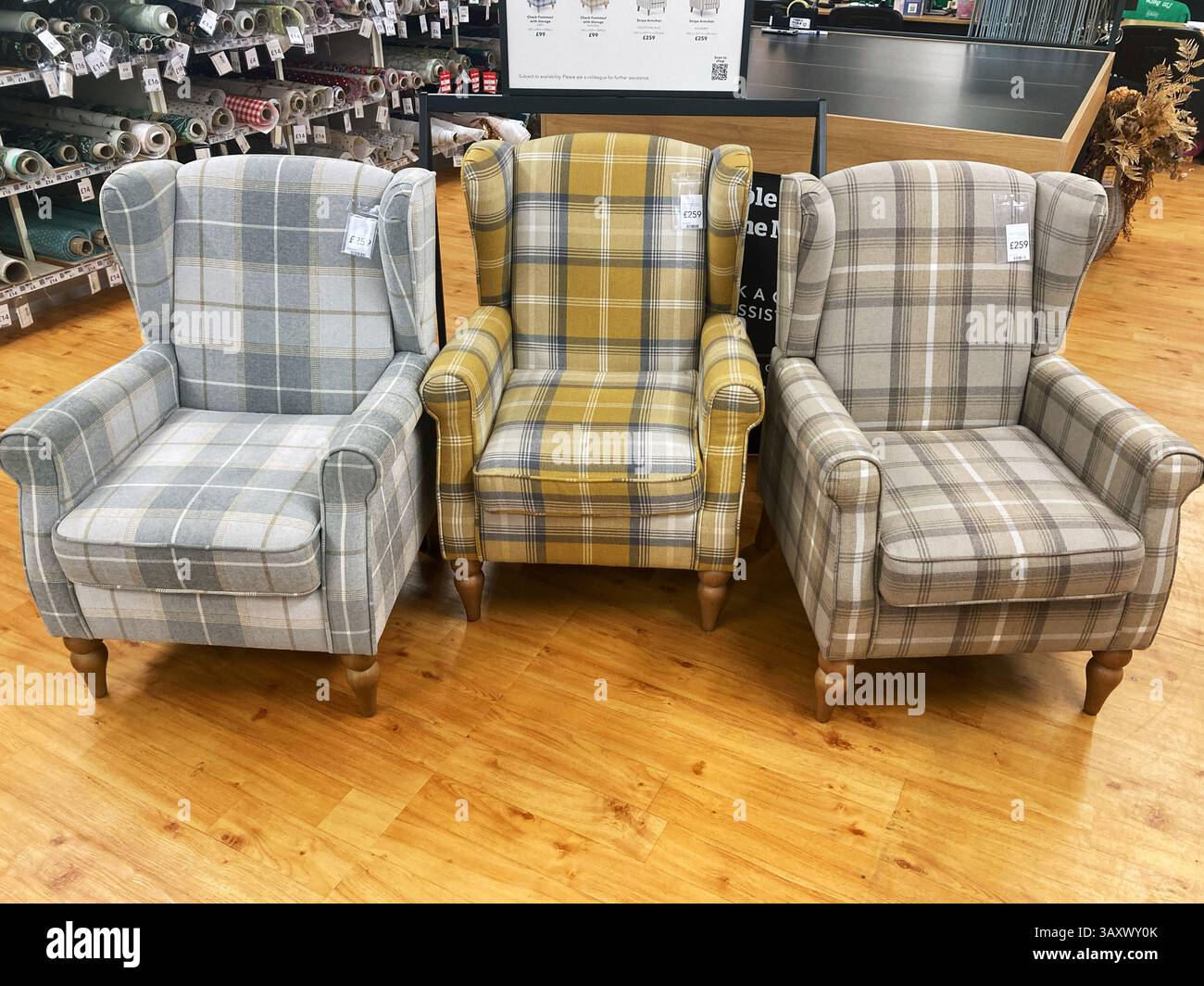 Checked fabric Wingback armchairs for sale - Smartphone Captured Stock Image