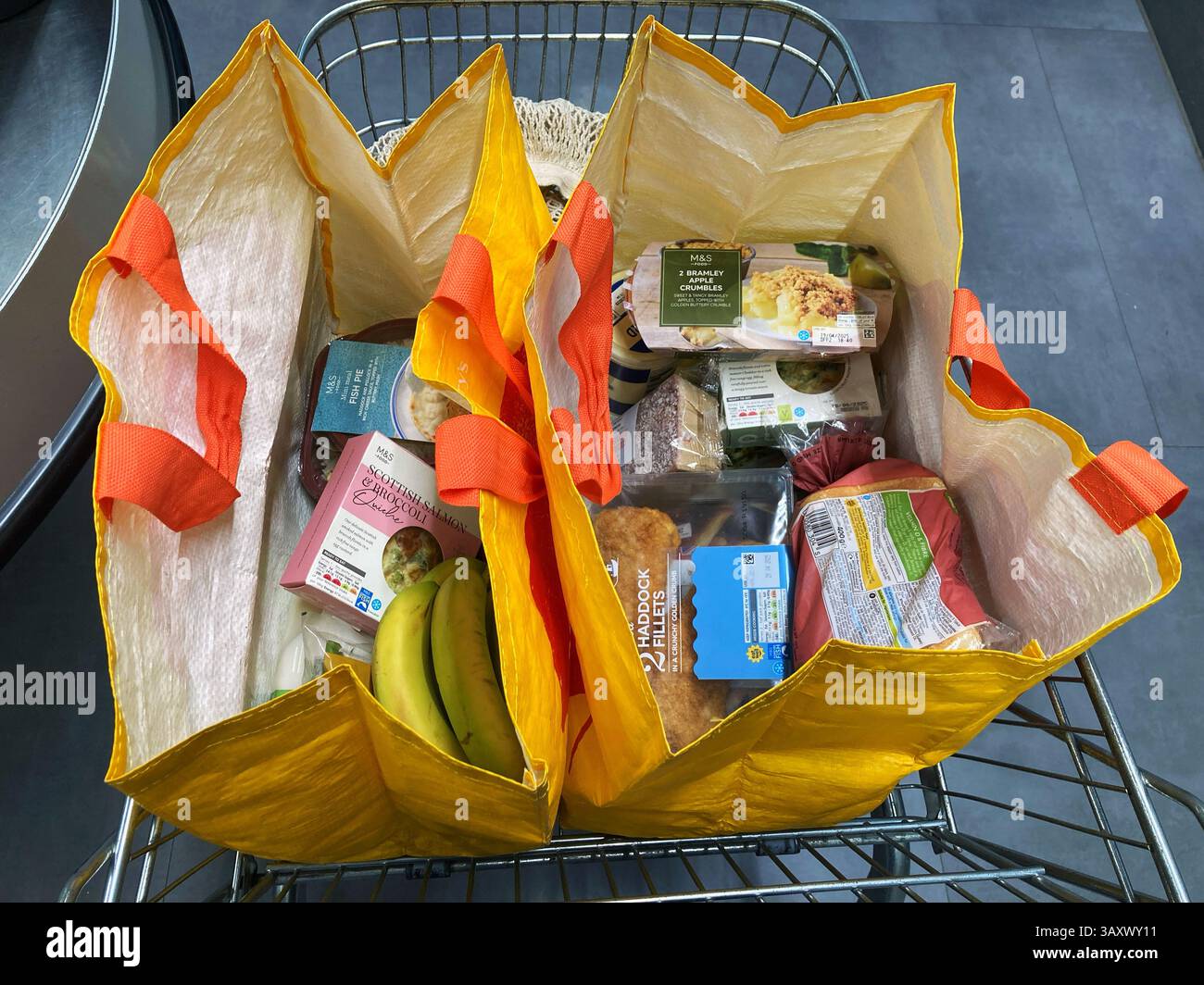 Full bags of shopping at Marks and Spencer - Smartphone Captured Stock Image