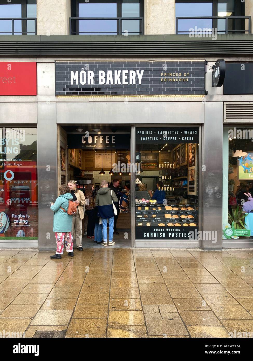 Customers queuing at Mor Bakery, Princes Street, Edinburgh Scotland Stock Photo