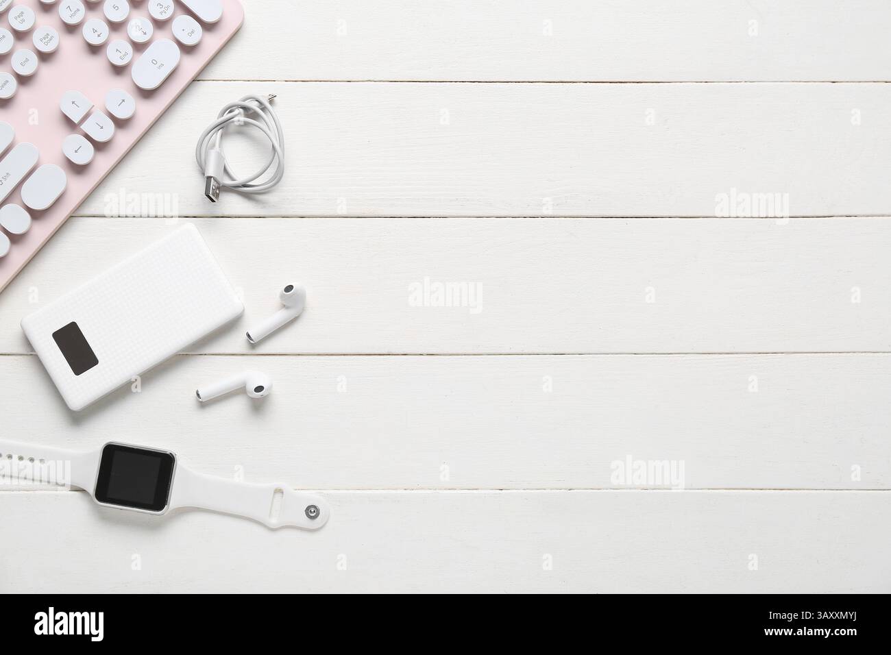 Composition with different modern gadgets on white wooden background Stock Photo