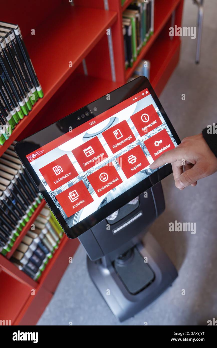 An interactive display shows various options in the library environment ...