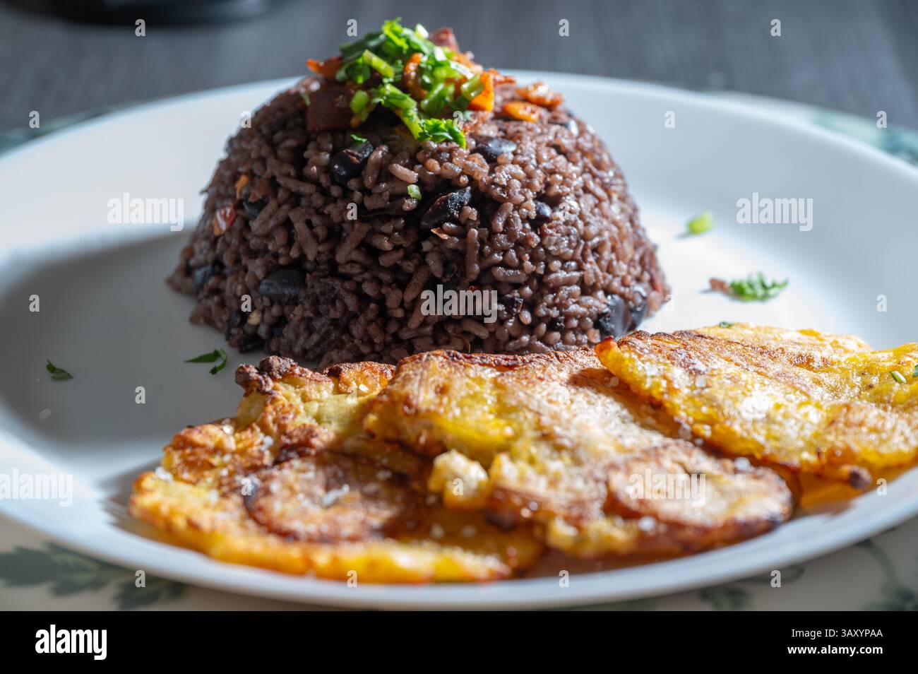 What Rice Is Congri Rice Rice Congri and Plantain Tostones, Delicious Cuban Food Stock Photo - Alamy
