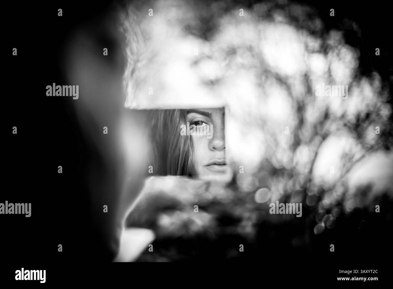 Black and White Portrait of a Woman Reflected in Broken Mirror Fragment ...