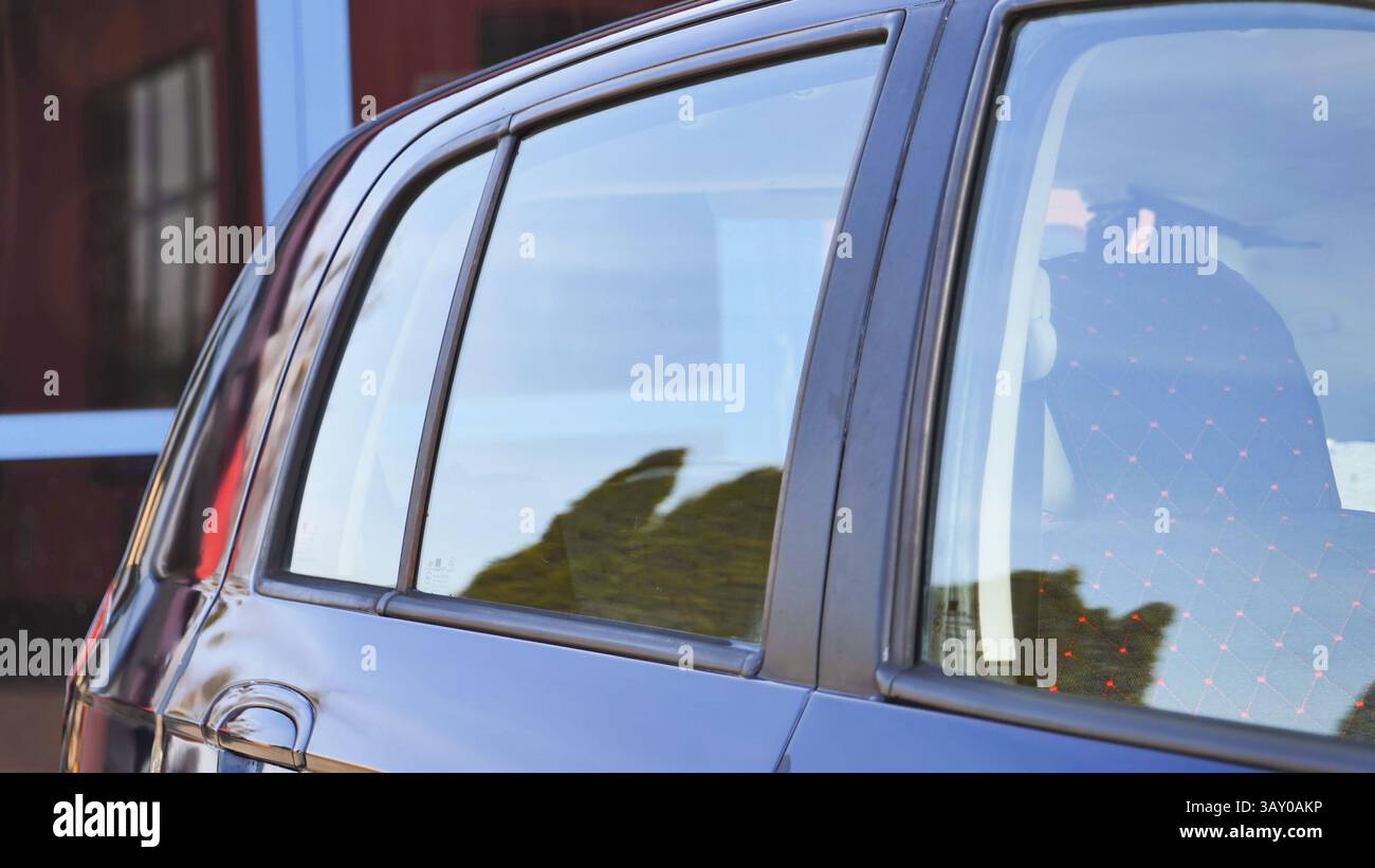 Shiny car windows reflecting trees after car wash Stock Photo - Alamy