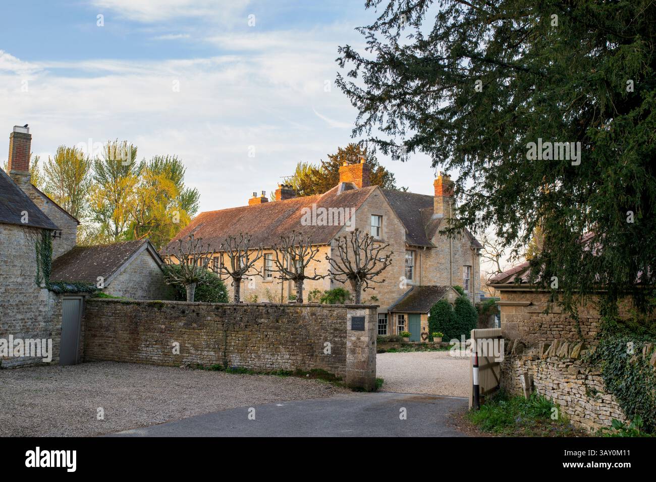 Old Church House at sunrise. Spelsbury. Cotswolds, Oxfordshire. England. Stock Photo