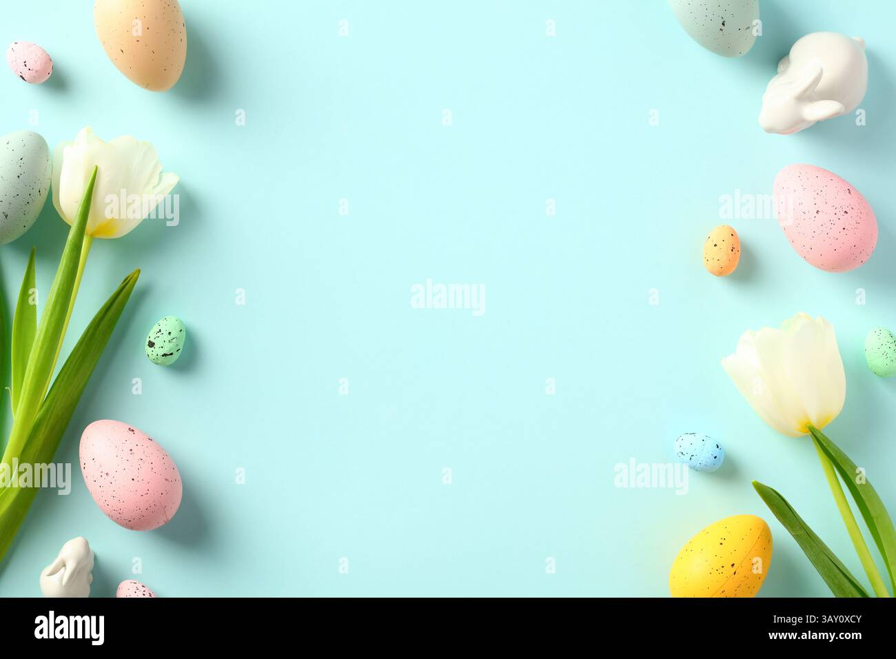 Happy Easter greeting card template. Double border frame made of colorful Easter eggs, tulips, decorative bunny. Stock Photo