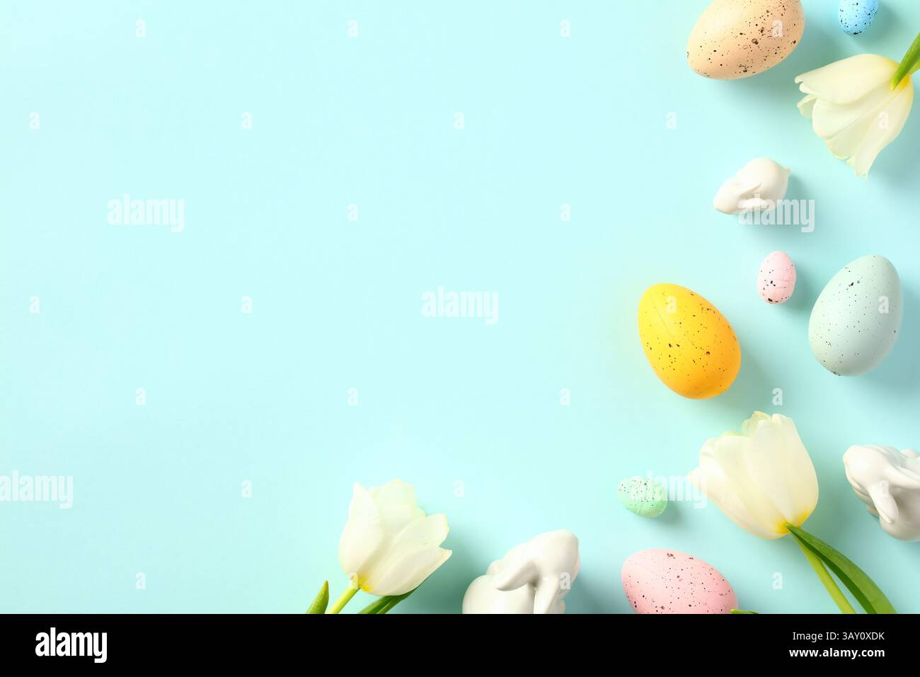 Happy Easter concept. Greeting card template with Easter eggs and spring flowers. Stock Photo