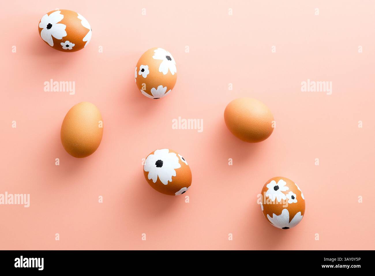 Creative layout with Easter eggs on pastel pink background. Happy Easter card. Stock Photo