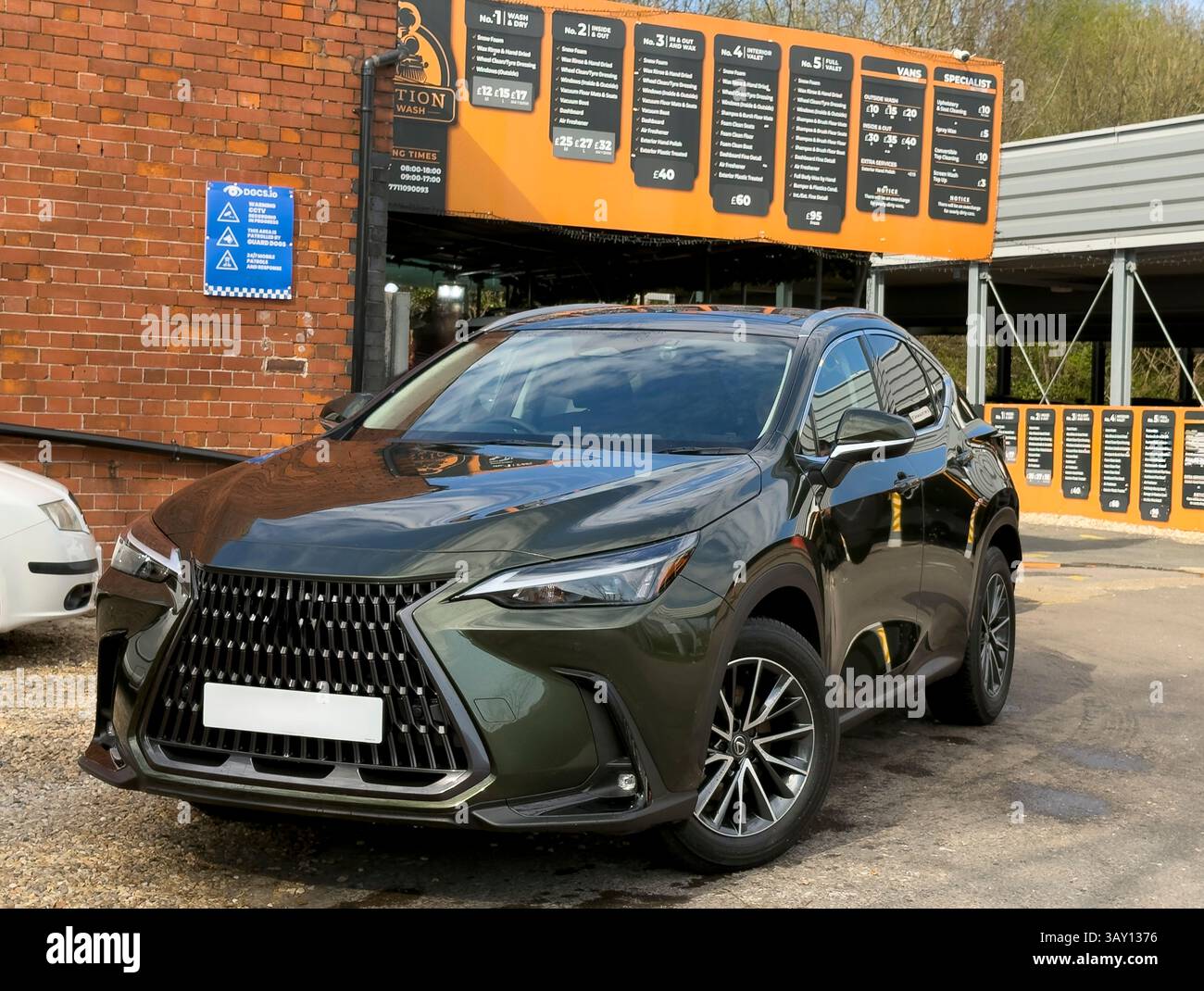 Basingstoke Hampshire England UK.  04.04.2025. New car with 2025 registration leaving a hand wash businesshaving been cleaned. Stock Photo