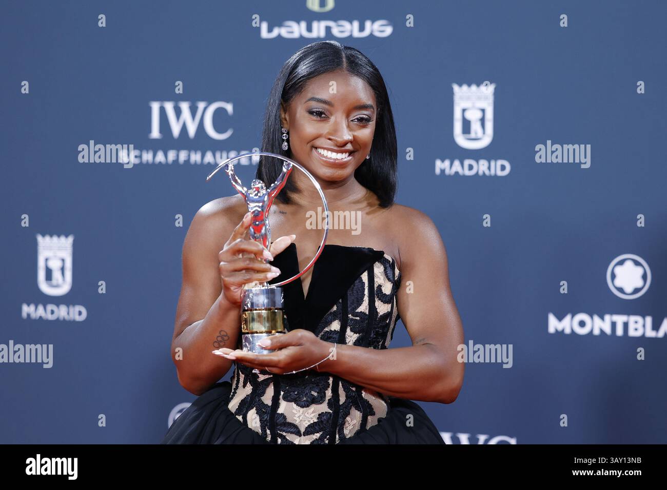 Simone Awore Simone Biles poses with the award during the Laureus World Sports ...