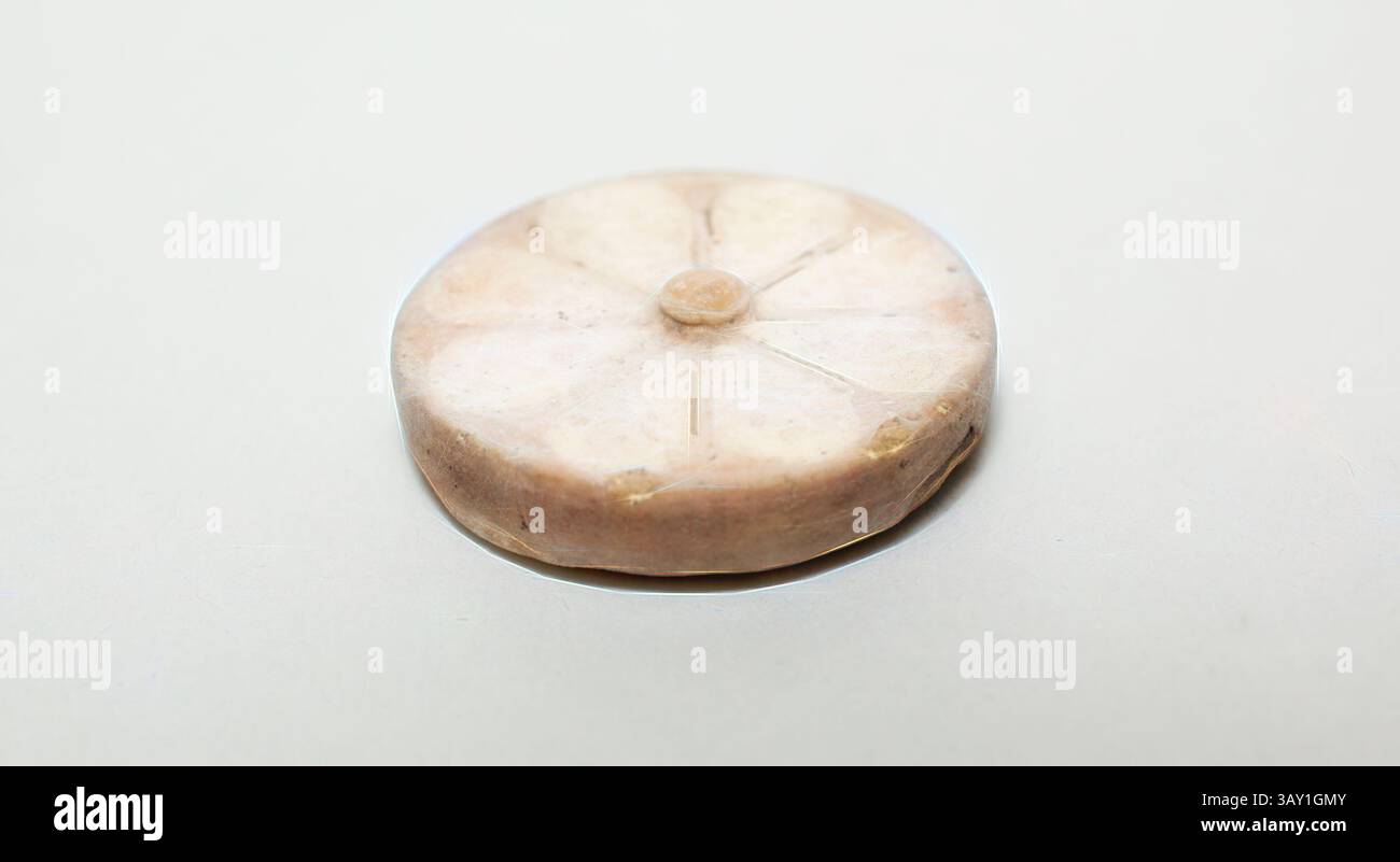 An intricately carved circular stone object featuring a floral design ...