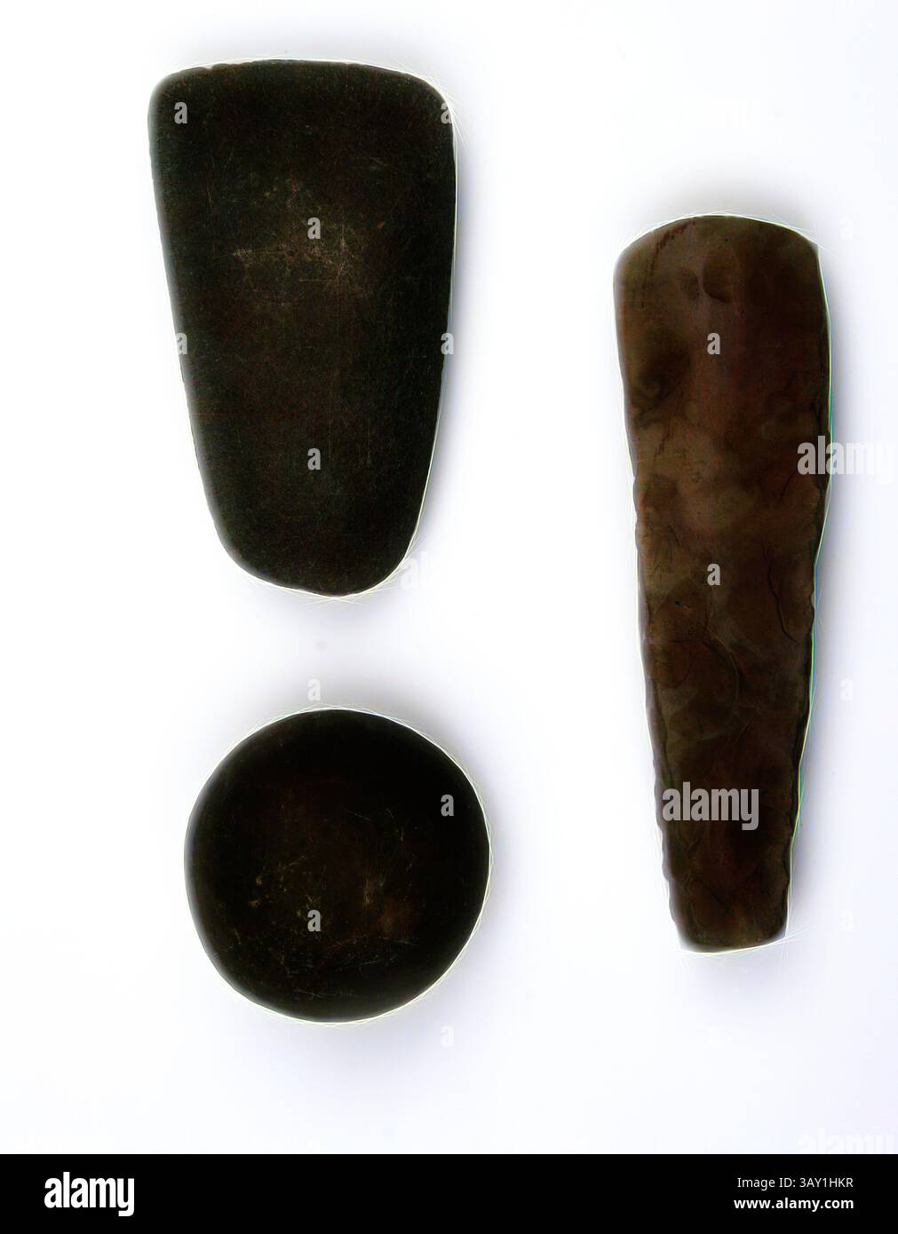 Three distinct stones are arranged in a triangular formation. The top ...