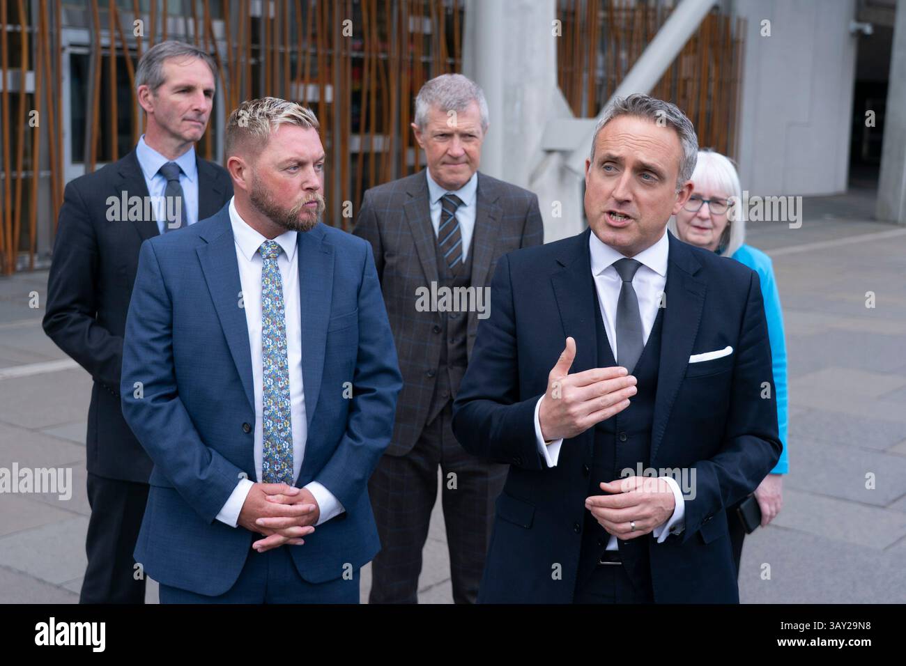Edinburgh, Scotland UK. 22nd  April 2025. Alex Cole Hamilton MSP  introduces new recruit to the Scottish Liberal Democrats, Jamie Greene MSP , outside the Scottish Parliament today. Mr Greens defected from the Scottish Conservatives whom he described as moving to the far-right. Iain Masterton/Alamy Live News Stock Photo