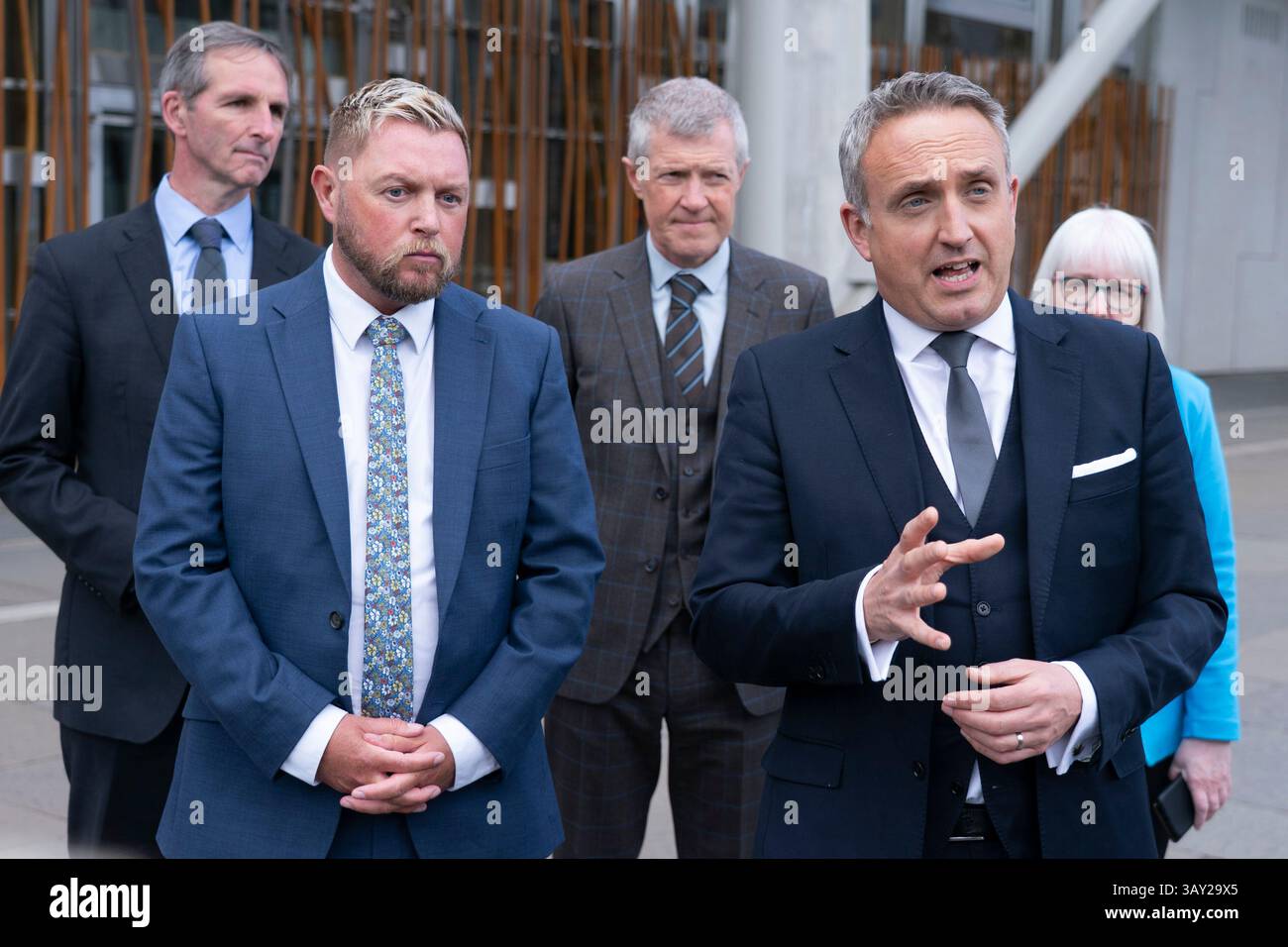 Edinburgh, Scotland UK. 22nd  April 2025. Alex Cole Hamilton MSP  introduces new recruit to the Scottish Liberal Democrats, Jamie Greene MSP , outside the Scottish Parliament today. Mr Greens defected from the Scottish Conservatives whom he described as moving to the far-right. Iain Masterton/Alamy Live News Stock Photo