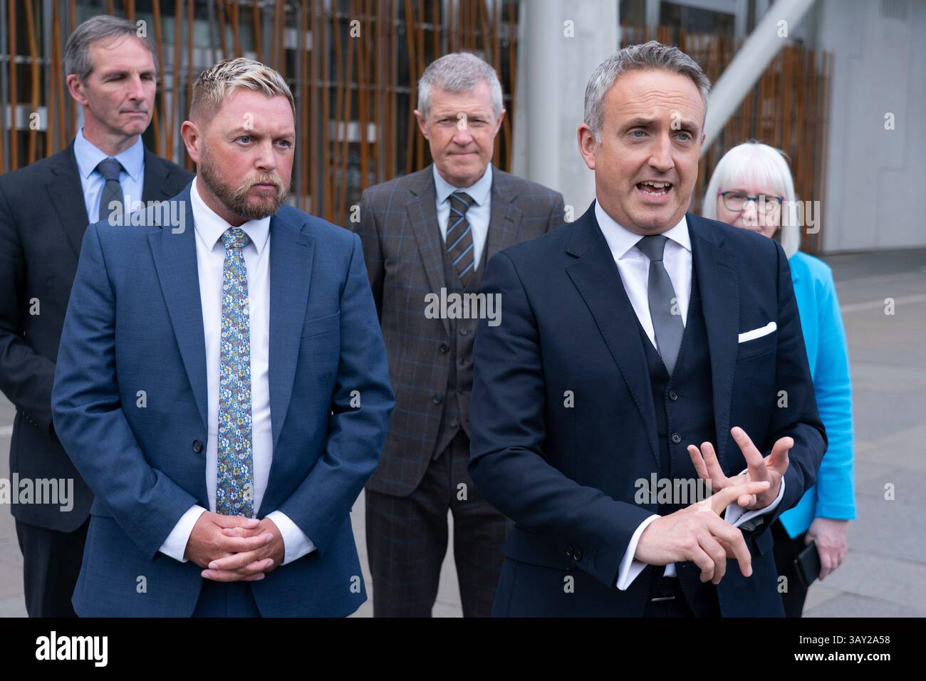 Edinburgh, Scotland UK. 22nd  April 2025. Alex Cole Hamilton MSP  introduces new recruit to the Scottish Liberal Democrats, Jamie Greene MSP , outside the Scottish Parliament today. Mr Greens defected from the Scottish Conservatives whom he described as moving to the far-right. Iain Masterton/Alamy Live News Stock Photo