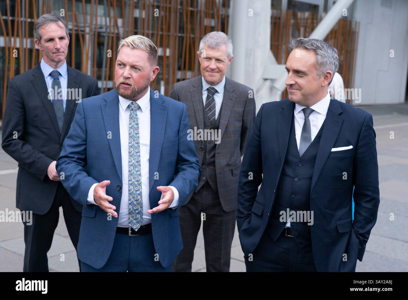 Edinburgh, Scotland UK. 22nd  April 2025. Alex Cole Hamilton MSP  introduces new recruit to the Scottish Liberal Democrats, Jamie Greene MSP , outside the Scottish Parliament today. Mr Greens defected from the Scottish Conservatives whom he described as moving to the far-right. Iain Masterton/Alamy Live News Stock Photo