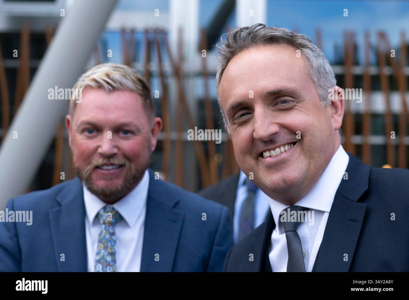 Edinburgh, Scotland UK. 22nd  April 2025. Alex Cole Hamilton MSP  introduces new recruit to the Scottish Liberal Democrats, Jamie Greene MSP , outside the Scottish Parliament today. Mr Greens defected from the Scottish Conservatives whom he described as moving to the far-right. Iain Masterton/Alamy Live News Stock Photo