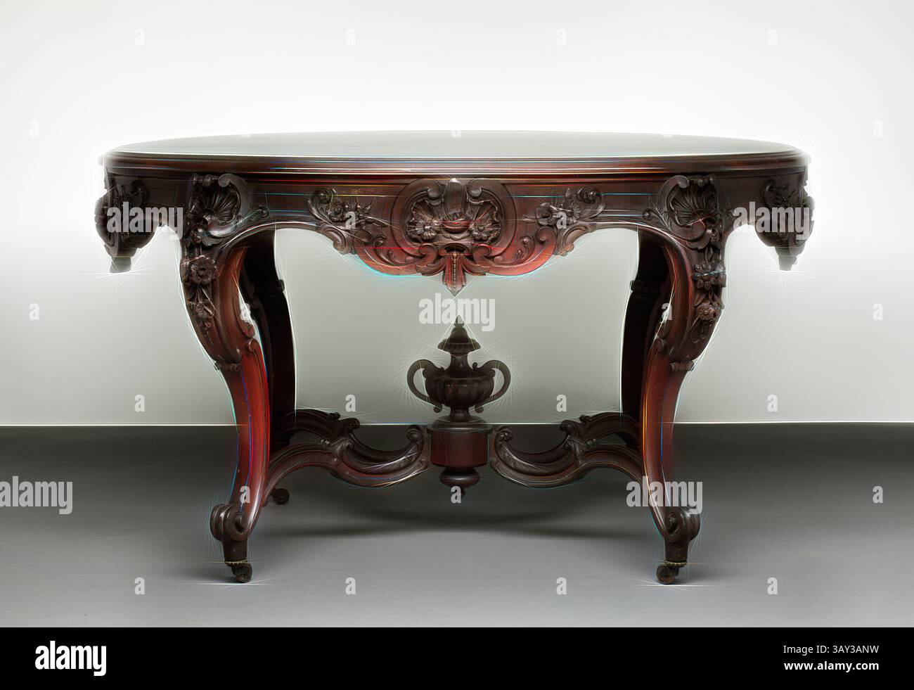 An intricately carved wooden table featuring ornate floral designs and ...