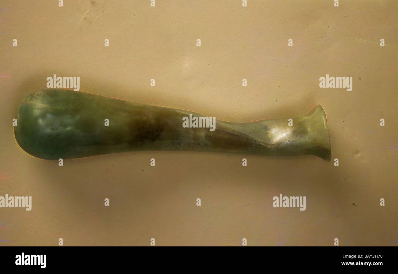 An elongated, smooth object featuring a slightly tapered end and a ...
