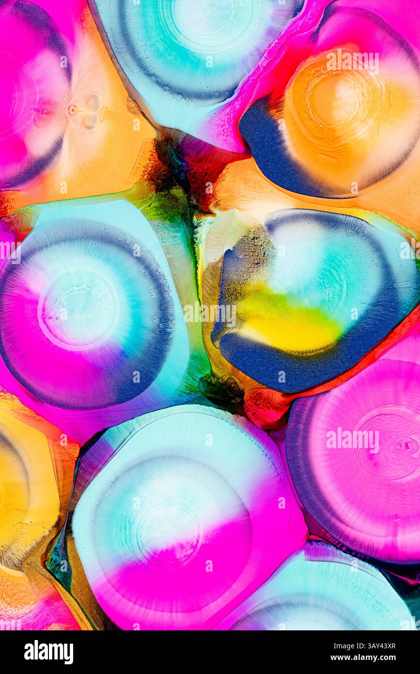 An array of vibrant, abstract ink patterns featuring a mixture of ...