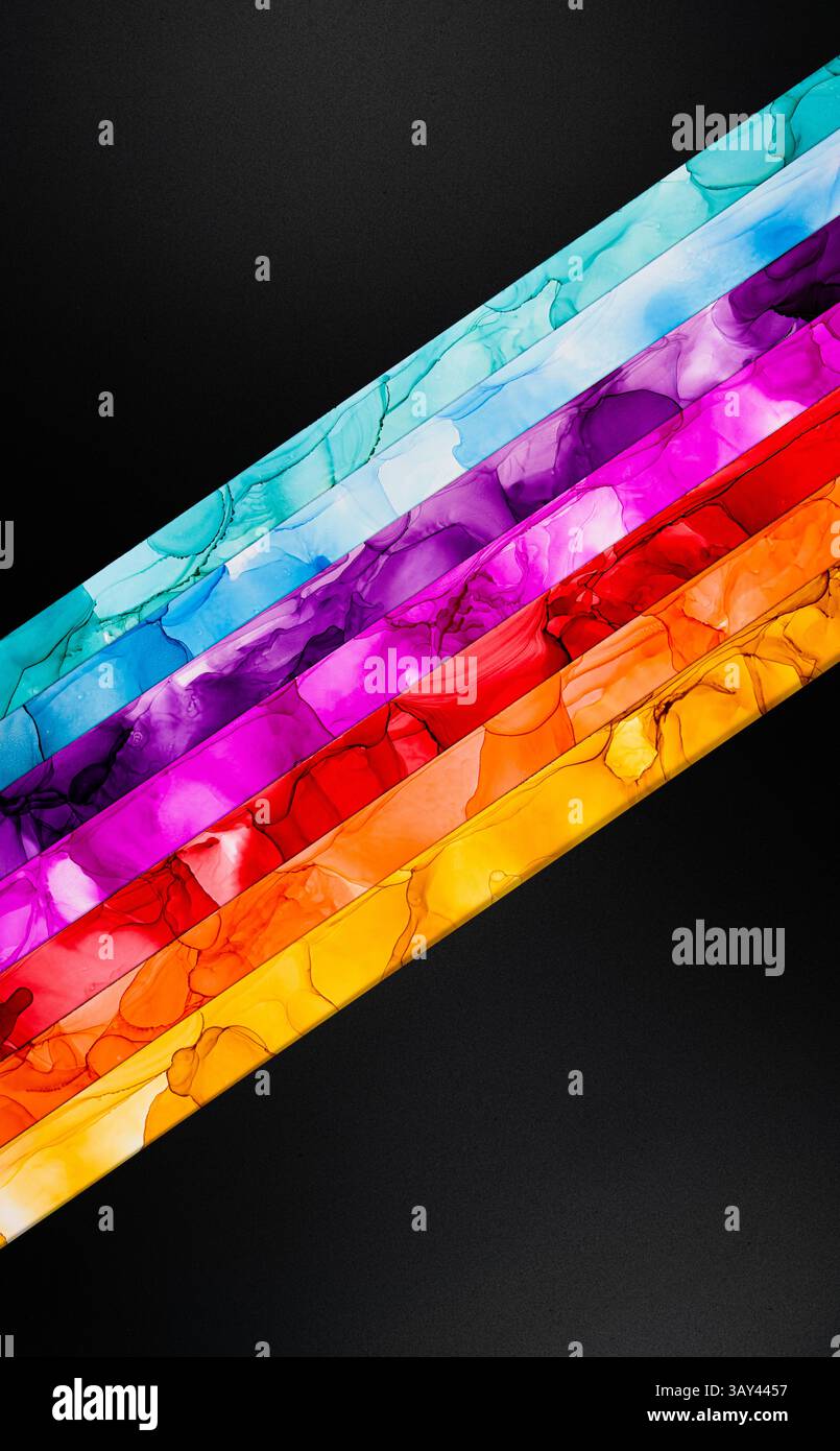A striking abstract image featuring diagonal stripes in vibrant hues like blue, purple, red, and yellow against a dark background, highlighting color Stock Photo