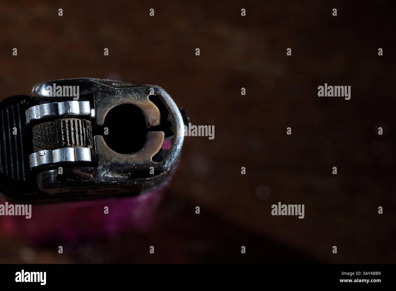 An old used hand cigarette lighter Stock Photo