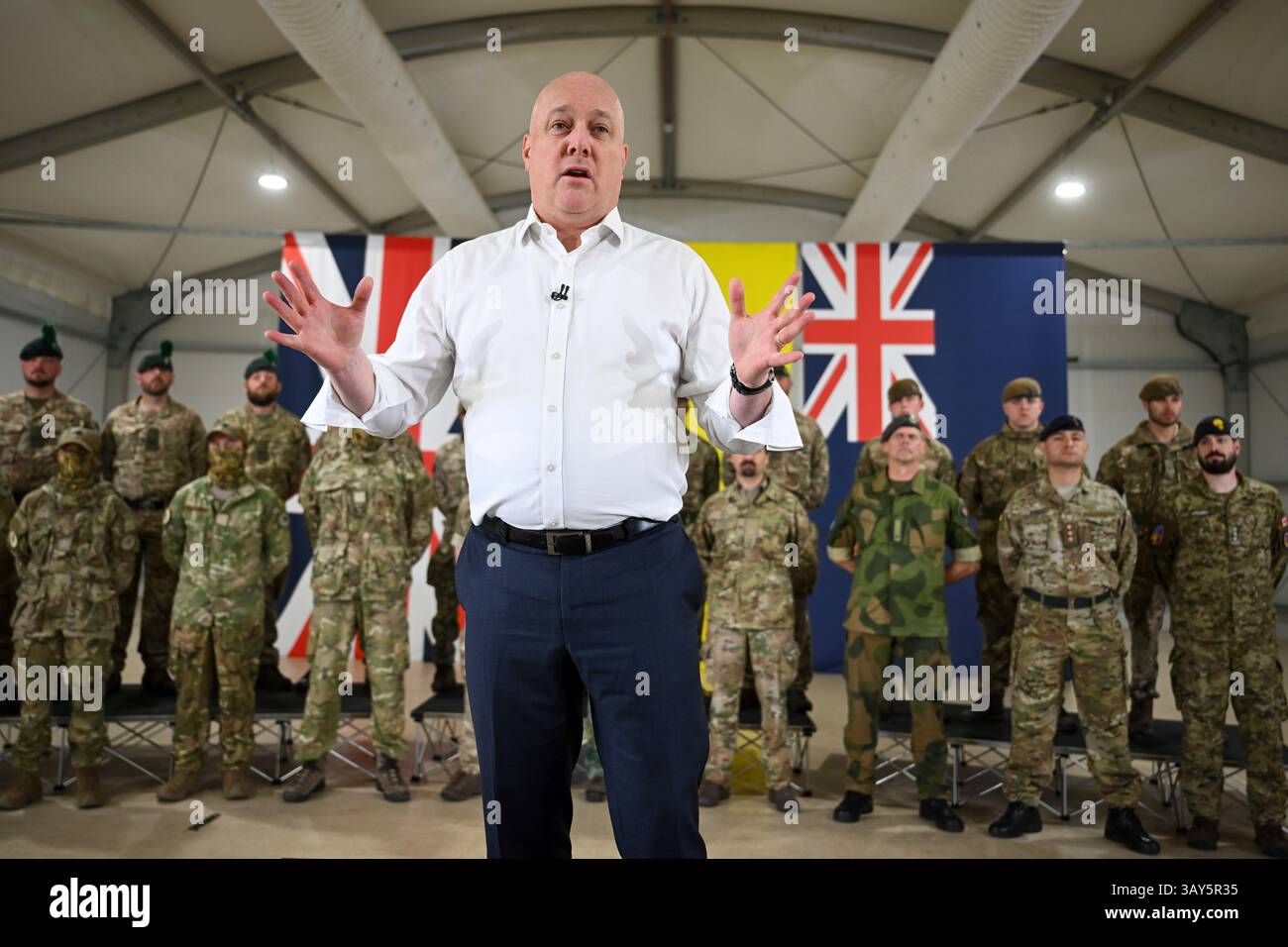 New Zealand's Prime Minister Christopher Luxon speak to troops during a ...