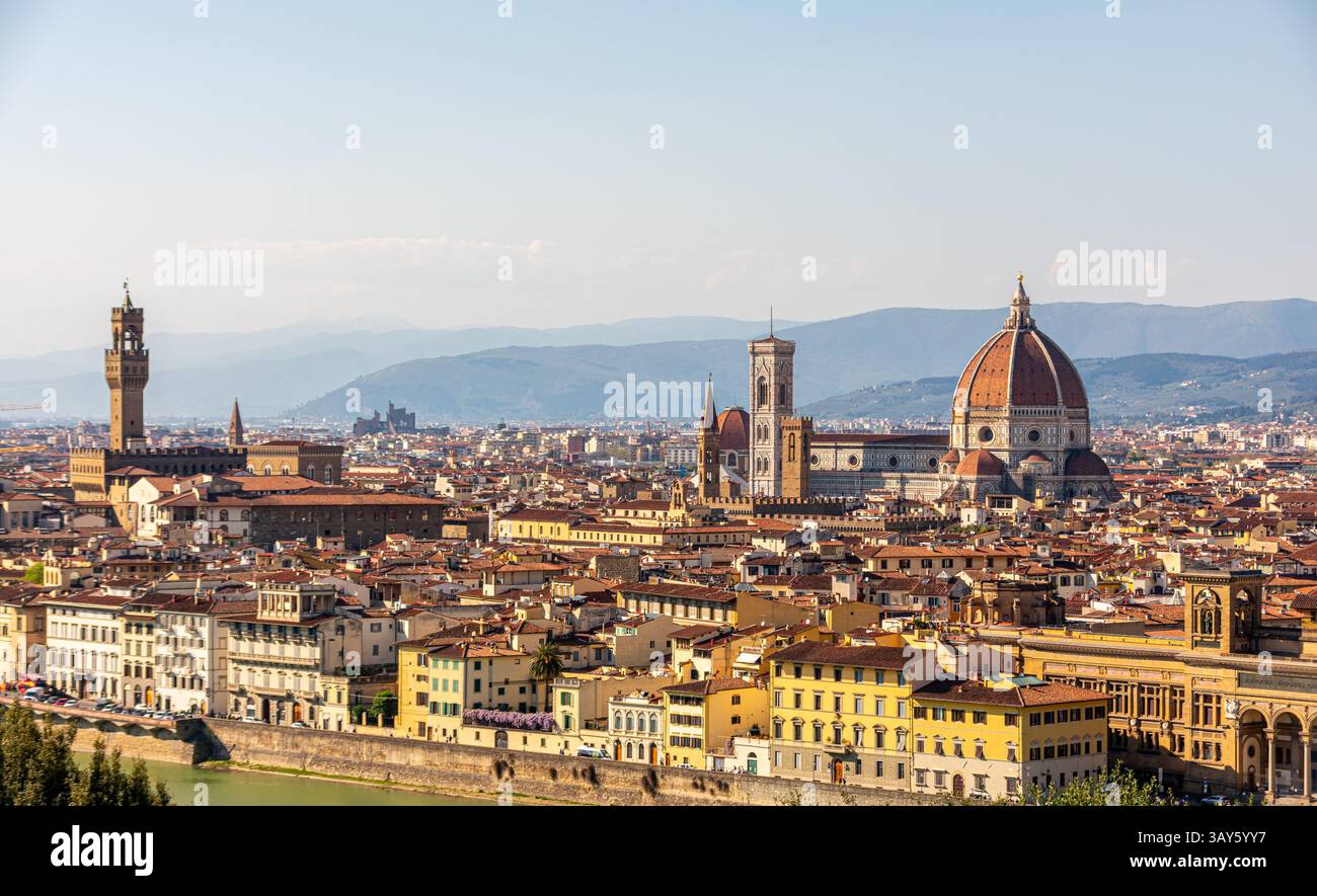 Panoramic view of Florence from Piazzale Michelangelo, with the iconic Duomo and terracotta rooftops bathed in Tuscan sunlight. Stock Photo