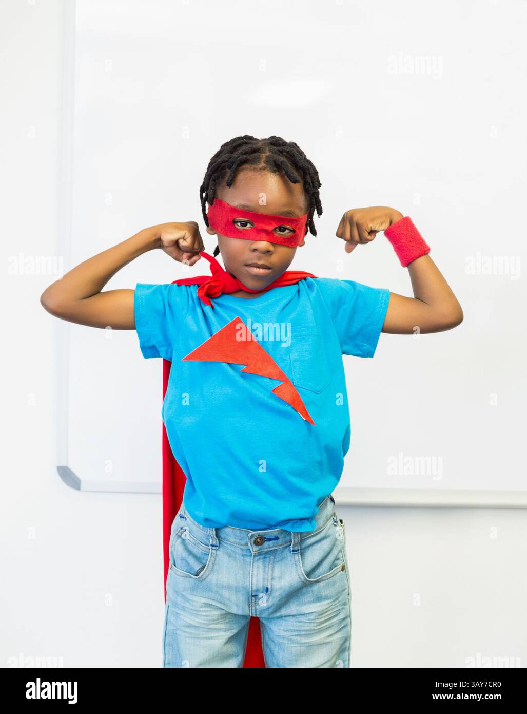 African american boy flexing hi-res stock photography and images - Alamy