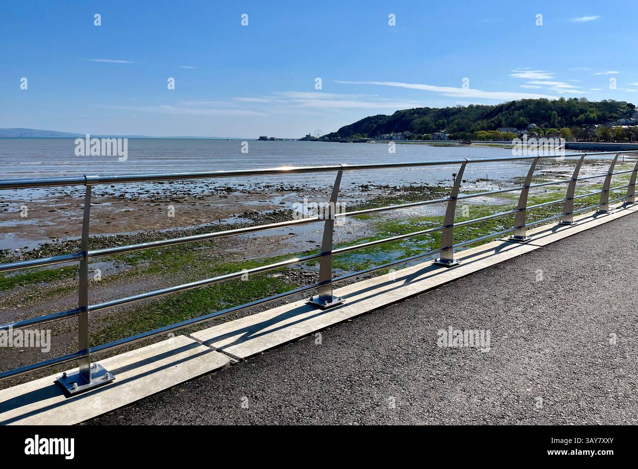 Looking towards Mumbles Pier from the Mumbles Prom, which was recently refurbished as part of the Mumbles Coastal Protection Scheme. 20th April 2025. - Smartphone Captured Stock Image