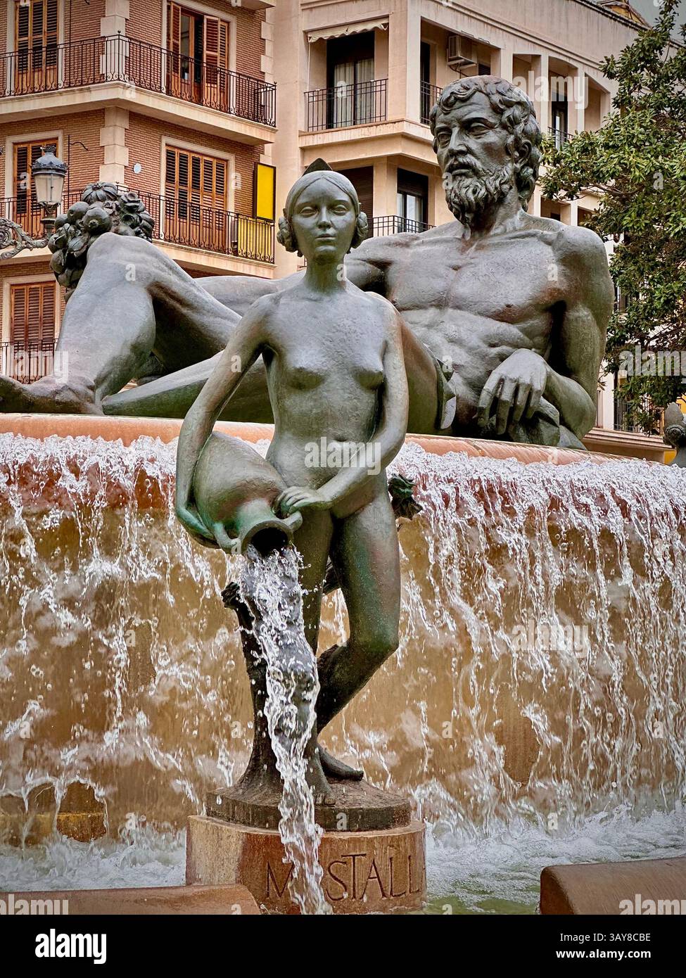 A striking fountain sculpture in a public square in Valencia, showcasing historical artistry. - Smartphone Captured Stock Image
