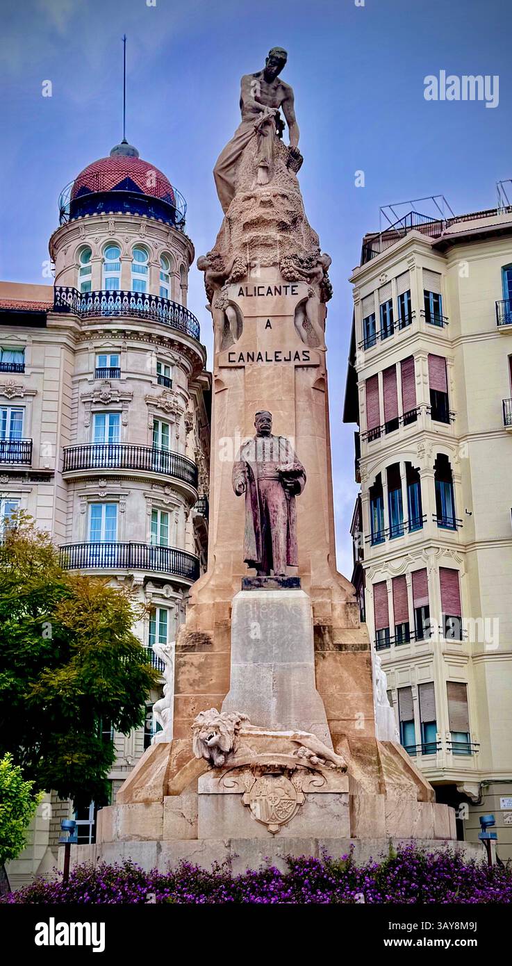 Striking urban monument featuring detailed sculptures and a majestic pedestal, surrounded by classic European architecture. The statue stands between - Smartphone Captured Stock Image