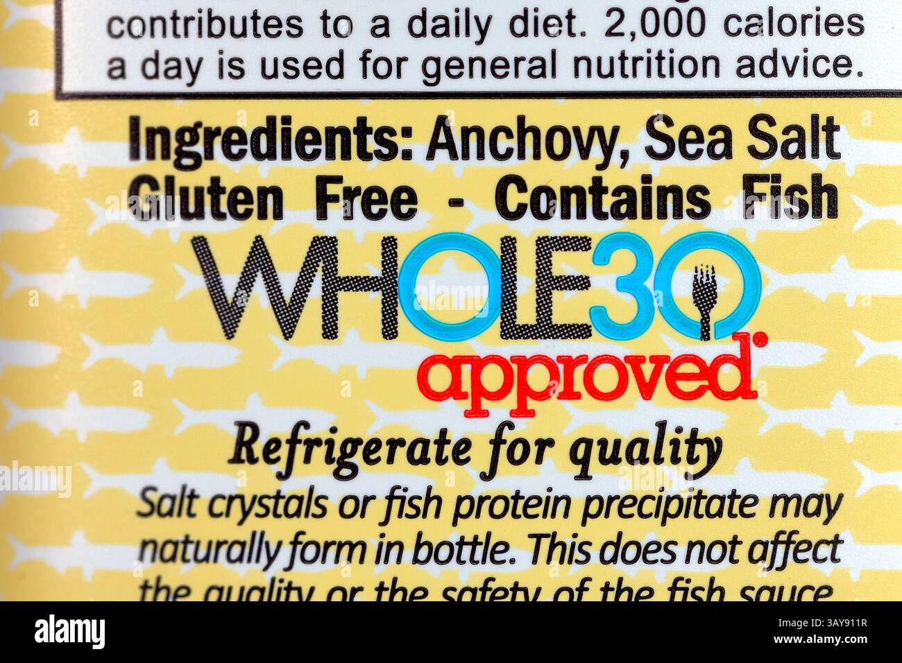 A Whole30 Approved logo on a foodstuff bottle. The symbol is marketed toward consumers shopping for items that fit the dieting program. Stock Photo