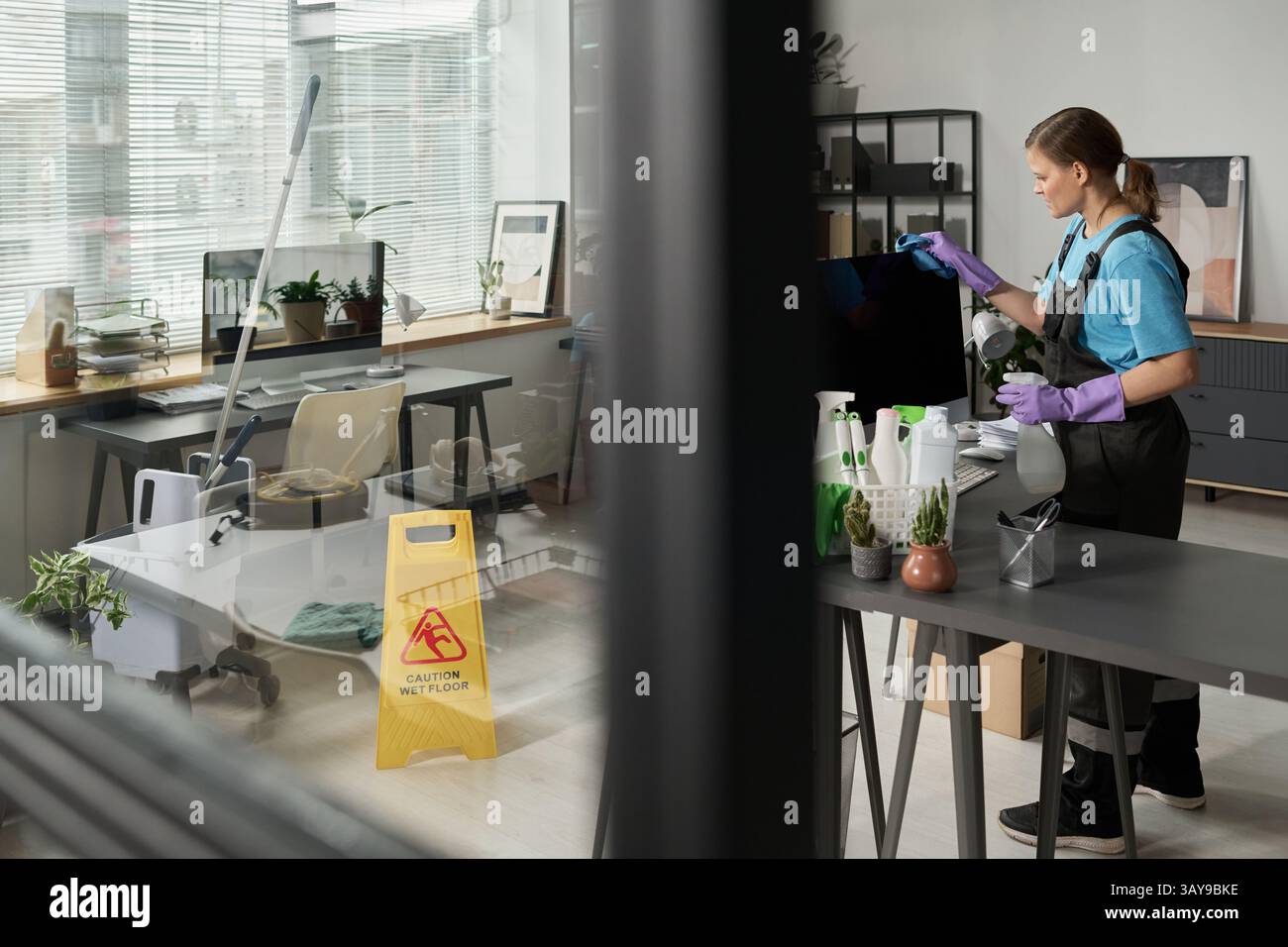 Woman wiping screen computer hi-res stock photography and images - Alamy