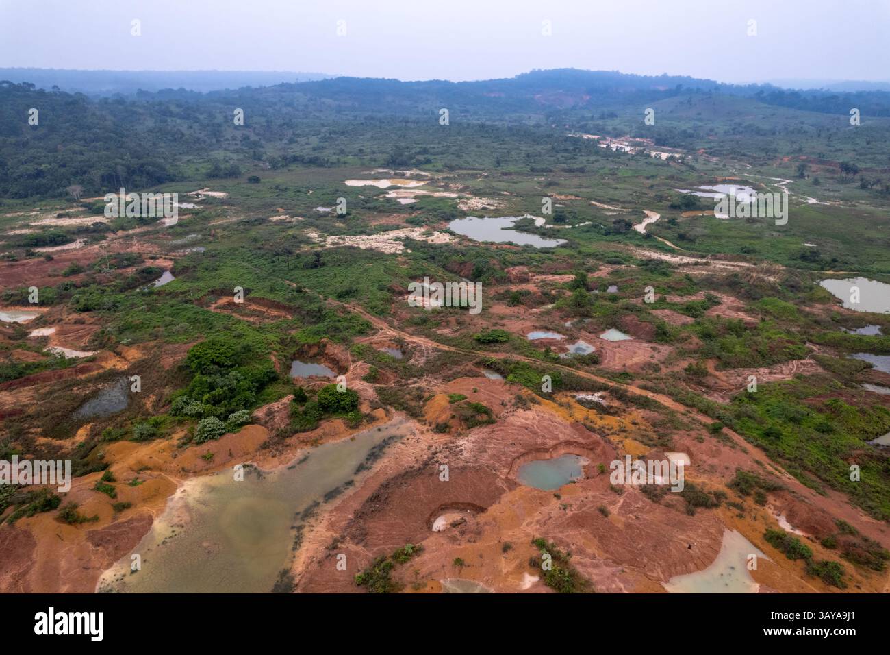 Illegal gold mining in a deforested area of the Amazon rainforest. Huge ...