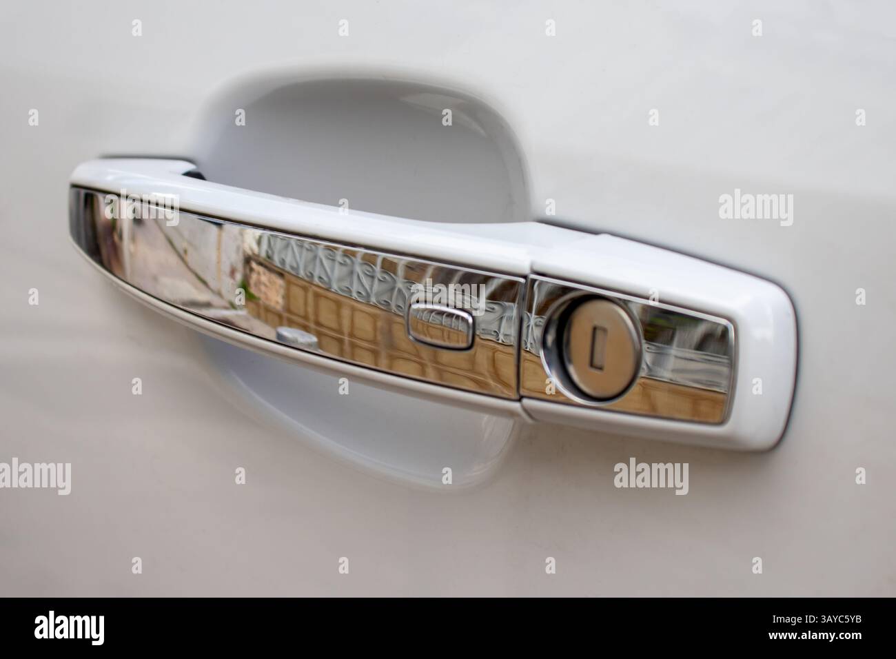 Car door handle with proximity activated open button for keyless entry Stock Photo