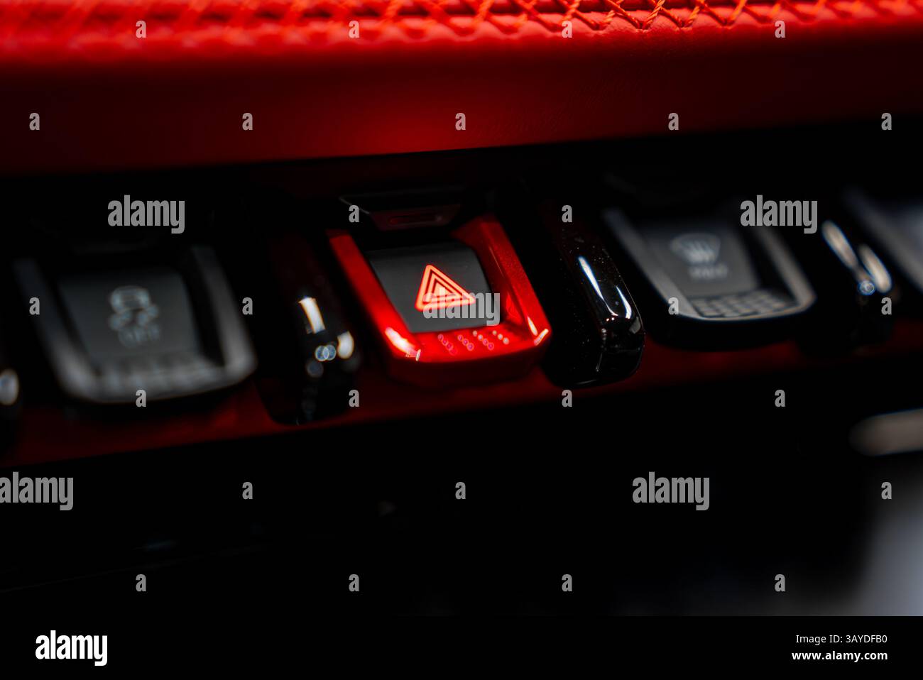 Close Up of Luxury Vehicle Control Panel with Red Hazard Button Stock Photo
