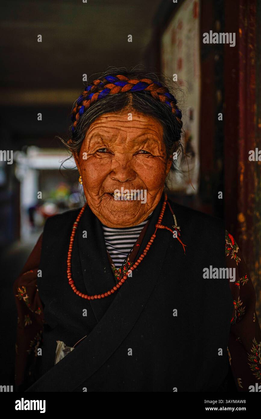 Portrait woman wearing traditional tibetan hi-res stock