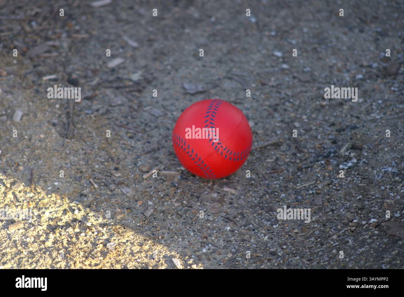 red baseball with navy stitching Stock Photo