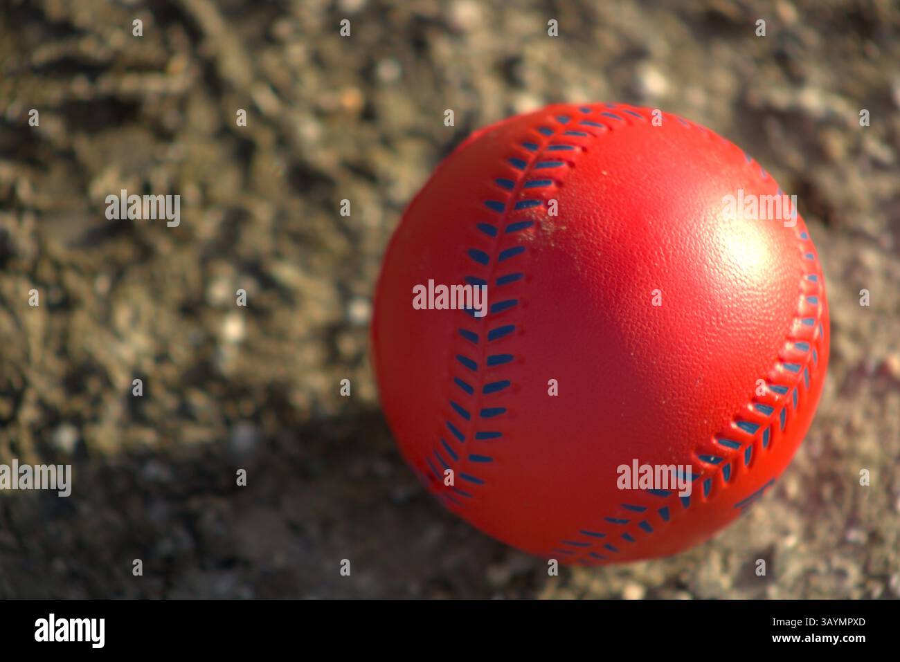 red baseball with navy stitching Stock Photo