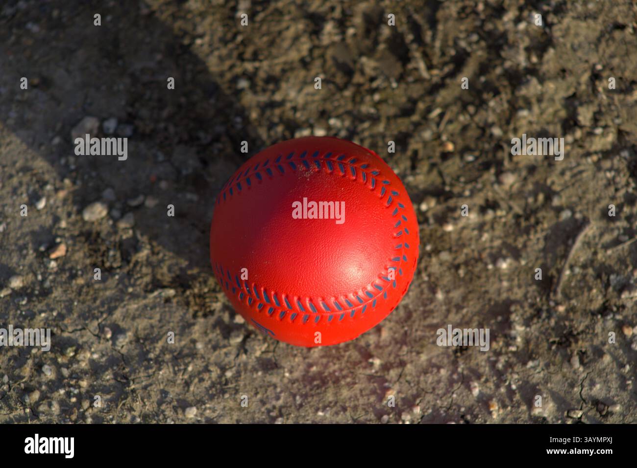 red baseball with navy stitching Stock Photo
