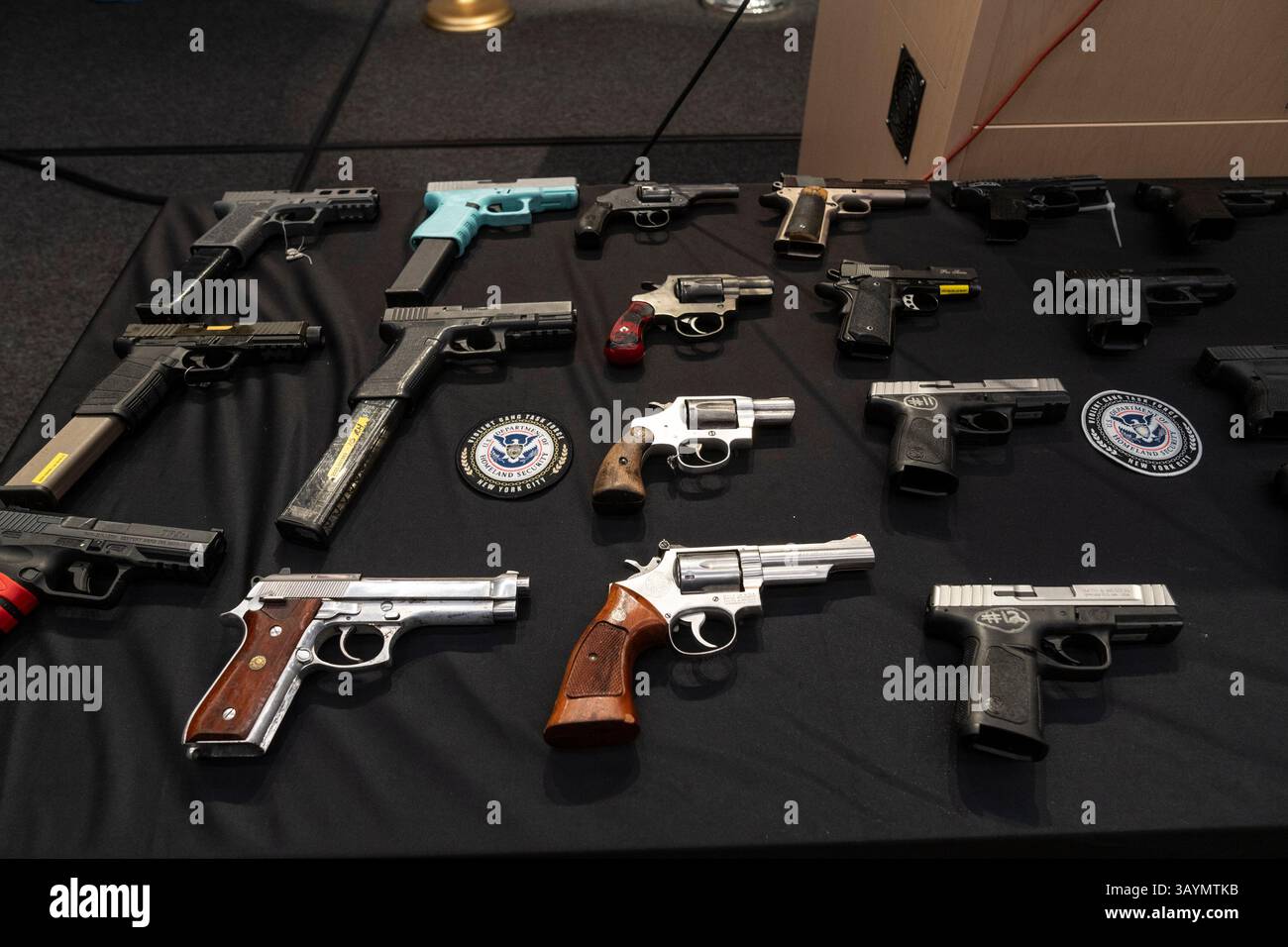 New York, USA. 23rd Apr, 2025. Confiscated guns on display during ...
