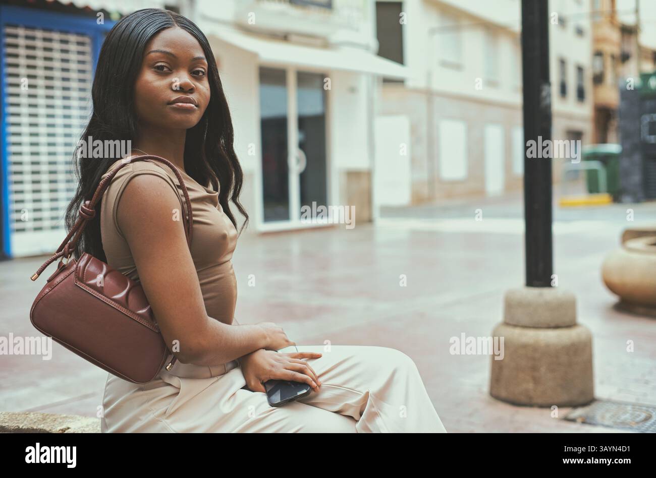 Female wearing beige top hi-res stock photography and images - Alamy