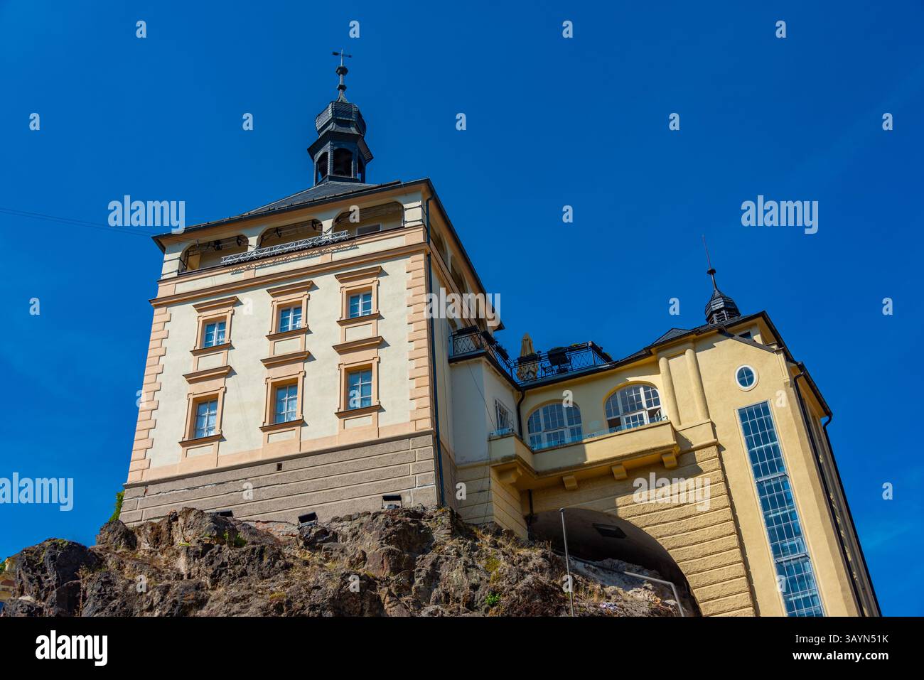 Colourful houses and castle tower at Karlovy Vary, Czech republic.IMAGE Stock Photo