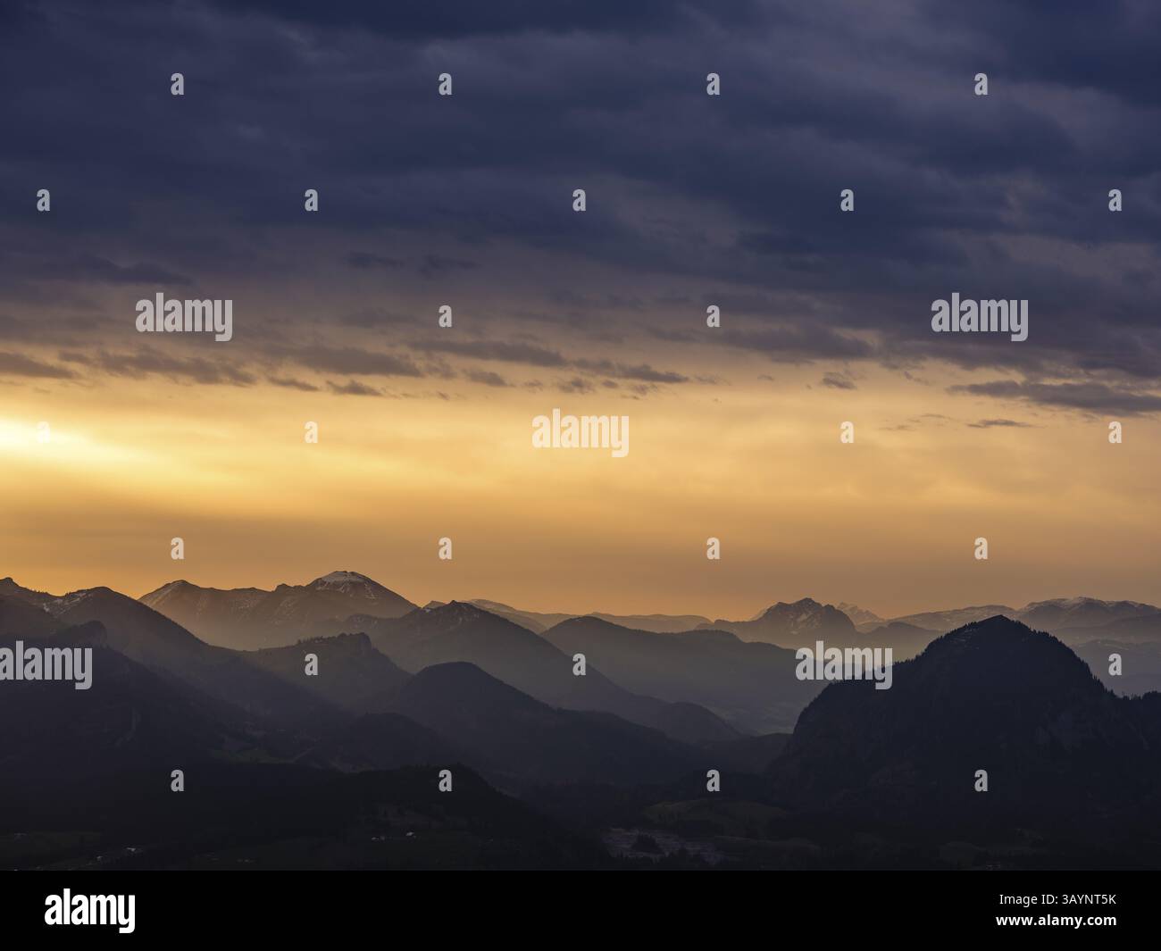 Alpine panorama under an overcast sky, illuminated by the sun through a gap in the clouds, Osterhorngruppe, Oberau, Berchtesgadener Land, Upper Bavari Stock Photo