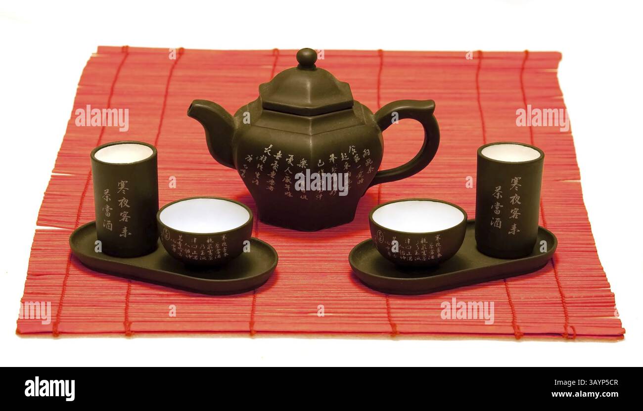 Chinese tea set on red mat Stock Photo