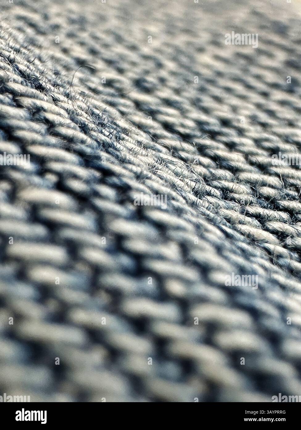 A close-up shot reveals the intricate texture of a woven blue and white ...